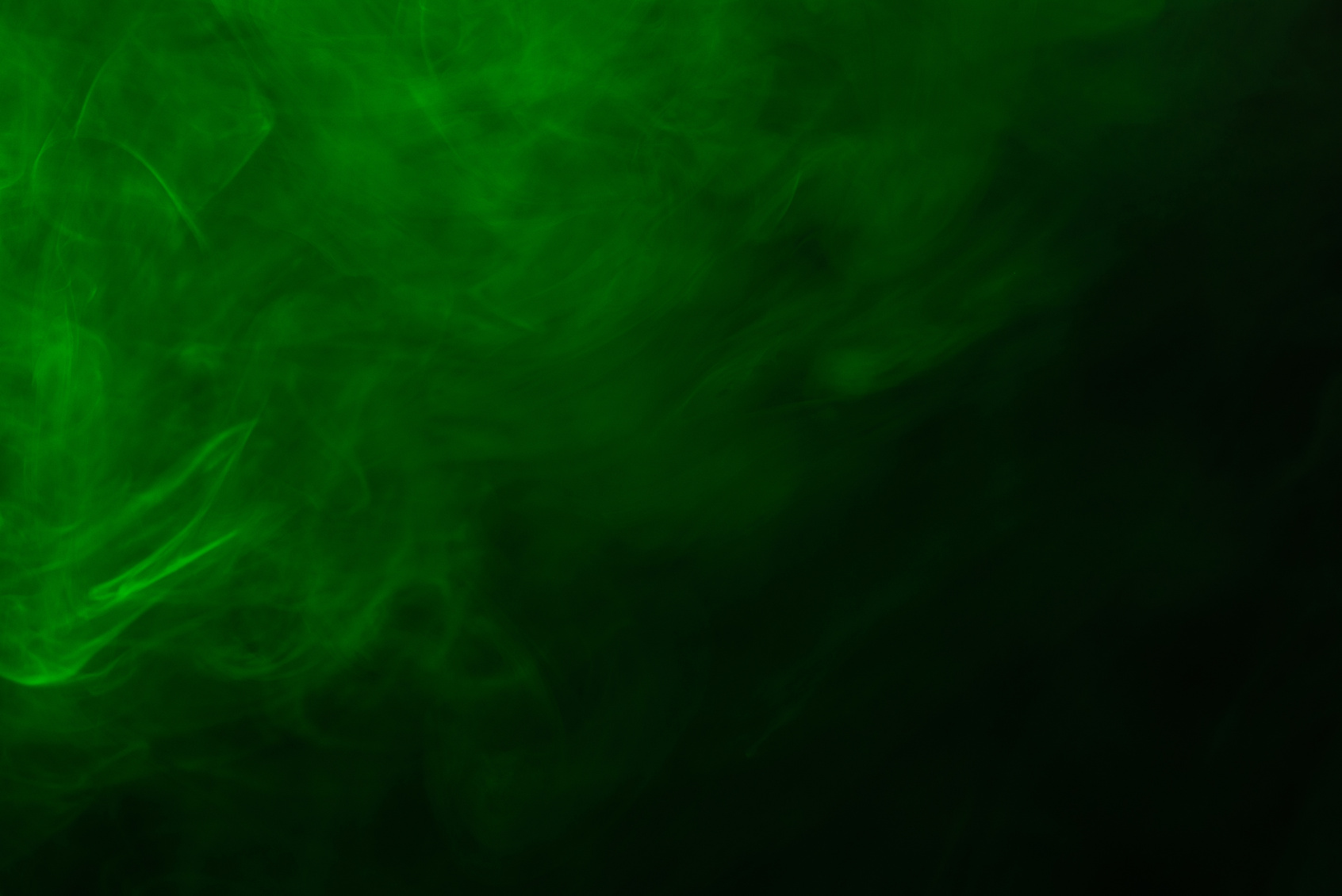 Green steam on a black background.